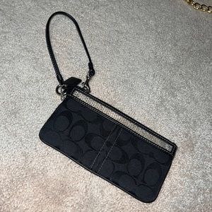 Coach- small wristlet black with silver bead like detail.. light used!
